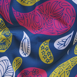 A white, lime and pink paisley print on a navy background. Each element of the paisley has navy accents. 