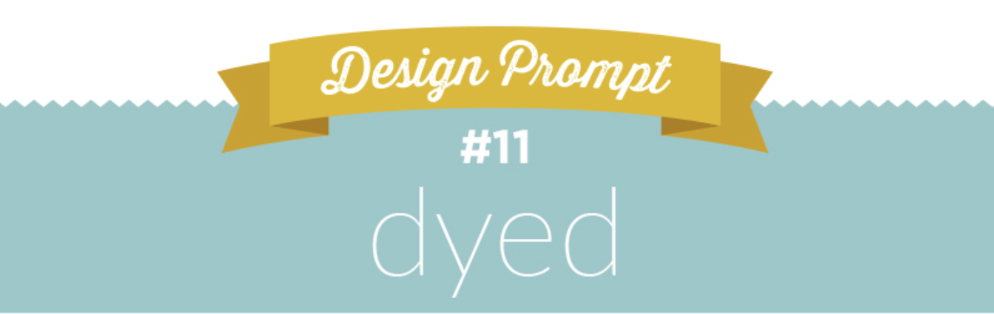 A logo with a white top quarter and a turquoise bottom three-quarters. There is a yellow ribbon going through both the white and the turquoise sections at the top with white cursive text in it that says "Design Prompt." Below the ribbon, in the turquoise section is the #11 in white font, with the word "dyed" underneath it, also in white and all lowercase. 