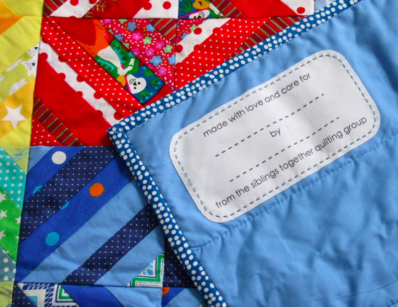 Each Siblings Together quilt is complete when a custom printed label is added to the blanket!
