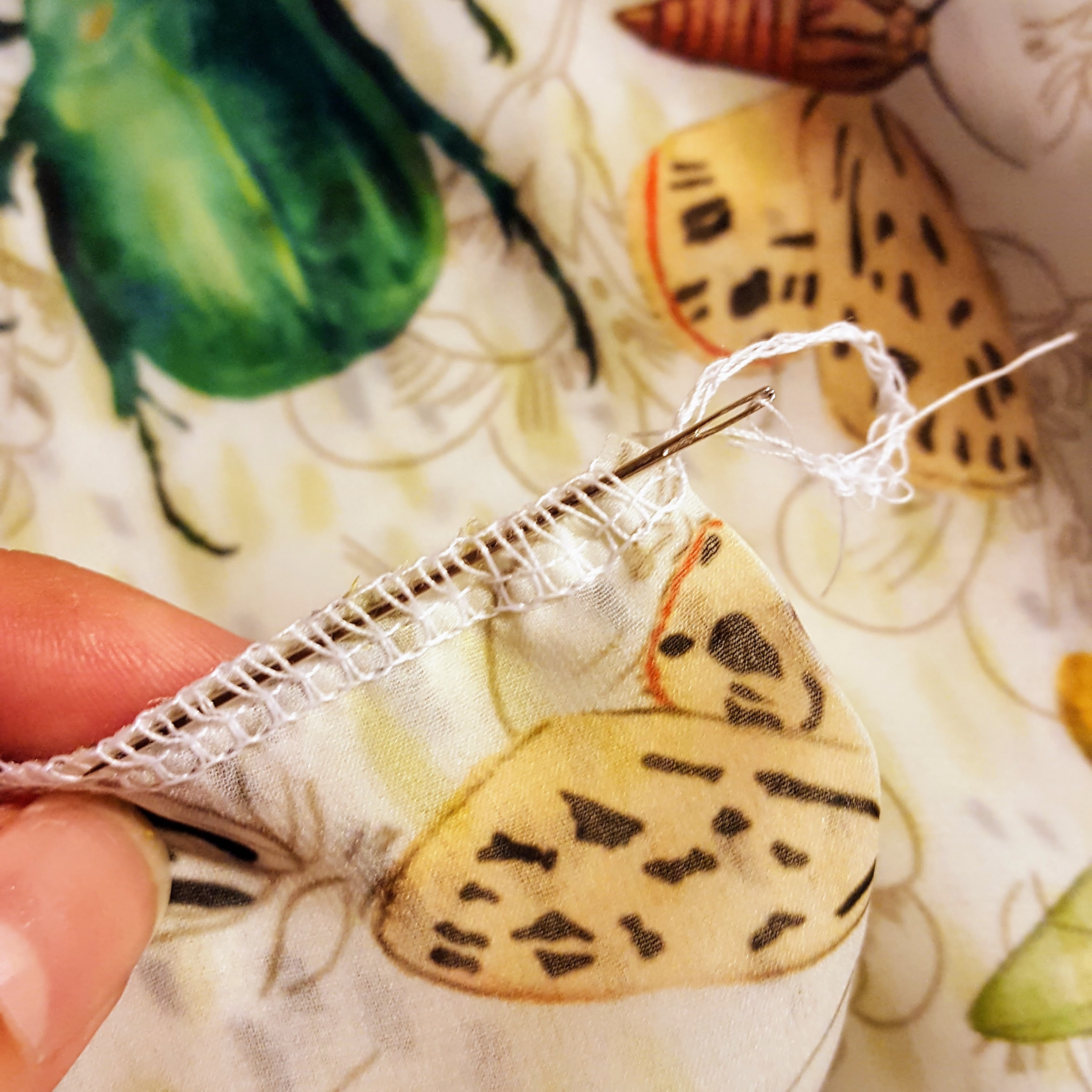 Feed the needle underneath the loops on the fabric and pull it through | Spoonflower Blog