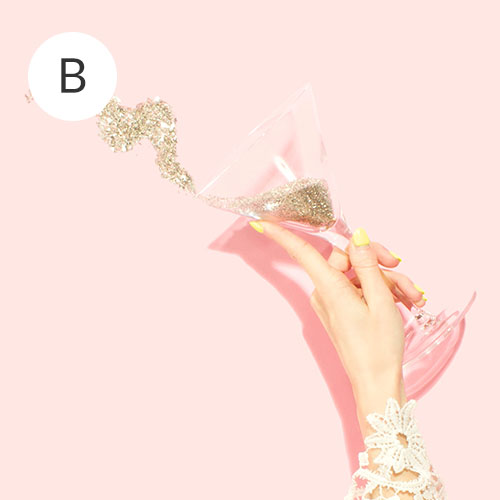 A hand holding a martini glass throwing out glitter | Spoonflower Blog 