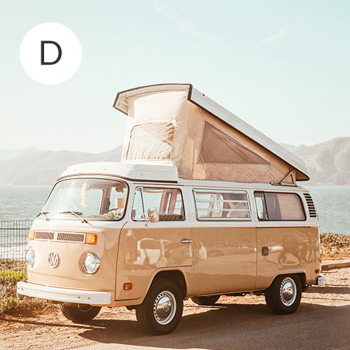 Cream VW camper van parked alongside the beach | Spoonflower Blog 