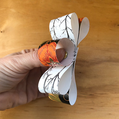 DIY gift bow step 3: Place the fastener through the center hole | Spoonflower Blog 
