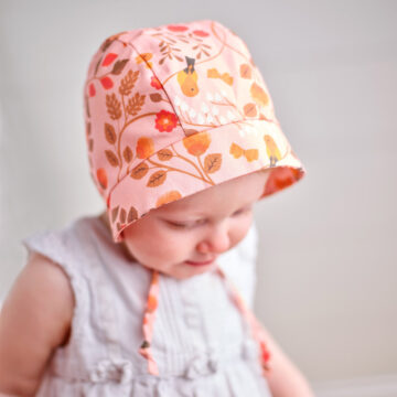 Baby wearing a handmade baby bonnet