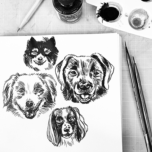 Kristin's sketches of four different dog faces in black paint on a white piece of paper.
