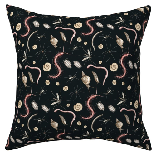 Marta's design Garden Creatures on a pillow. Small snails, worms and other bugs crawl around on a black background. 