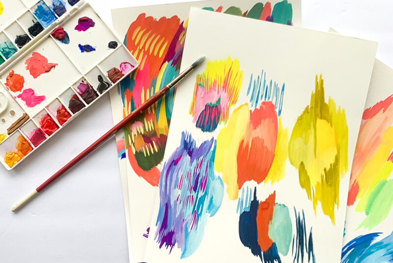 Paint palette with colorful paintings with bold brushstrokes