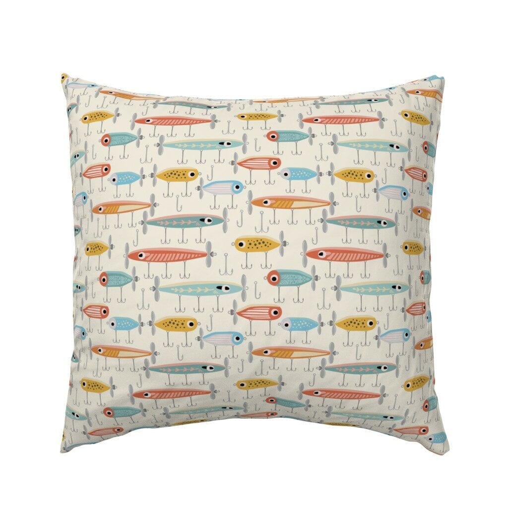 Square pillow featuring colorful fishing lures of various sizes