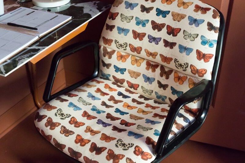 Upholstered chair with butterflies