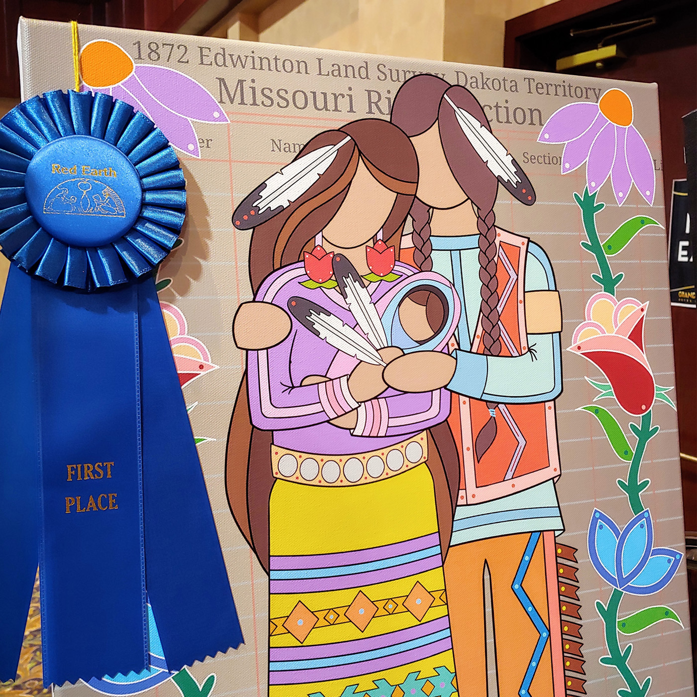 A photograph of Bill Brien’s first place winning canvas art that depicts an indigenous couple standing together while embracing their small baby who is wrapped snuggly in their arms. The illustration’s colors are bright pastels and feature large florals against a beige background found often in ledger art drawings.