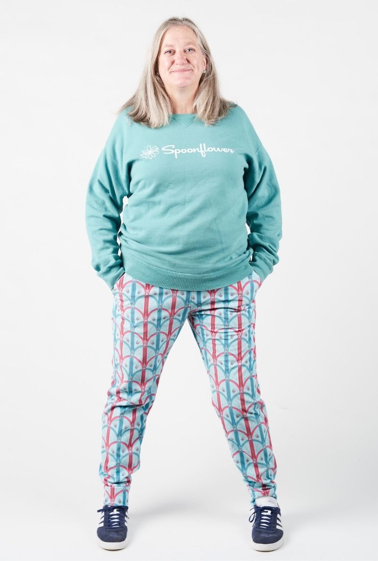 Sue wearing her blue joggers with red and blue zipper motifs