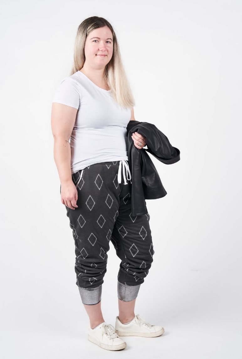 Sarah wearing her black joggers with white diamonds
