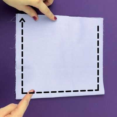 Arrow indicating where to sew the inner pocket: around the edges minus the top