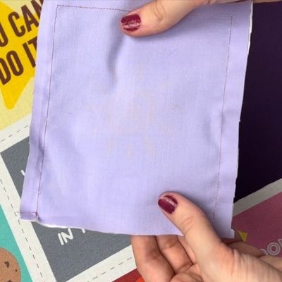 Lilac fabric used as a backing for each love note