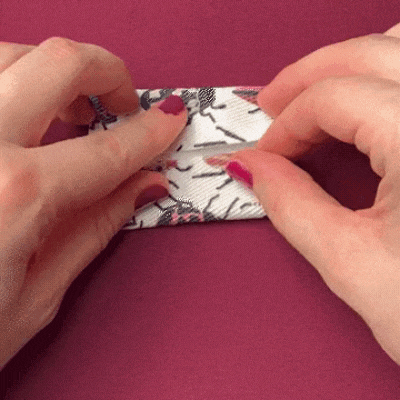 GIF: Folding the D-ring tab and clipping in place