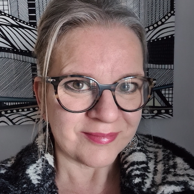 white woman gray hair gray background