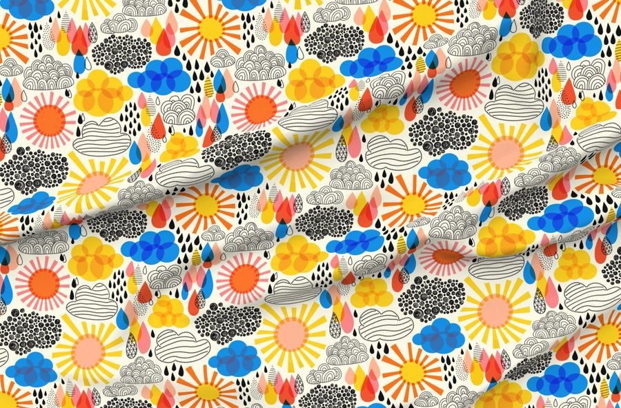 rippled fabric with blue, orange and yellow clouds and suns