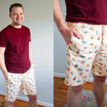 Meg's husband Joey wearing a red short and his handmade shorts. Shorts are cream colored with colorful tiny florals