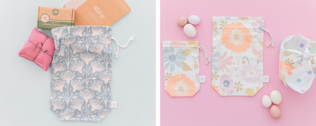 Two images have been placed into one rectangular image. On the left, a reusable cloth bag with a white drawstring closure lays on a light blue surface. The bag features repeating white eucalyptus flowers on a light blue background. Small gifts to go in the bag, a notebook, small pink sachets tied together with twine and a box of steel clothes pegs surround the top of the bag. On the right, three small fabric gift bags with pink and peach repeating flowers on a white background lay on a pink surface. Several small groupings of light speckled eggs are to the top left and bottom right.