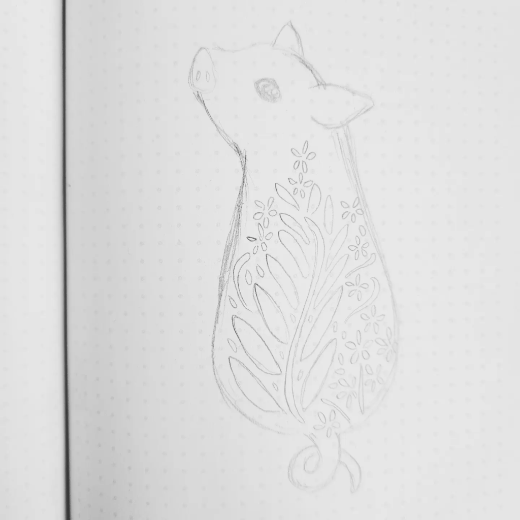 A beginning sketch of Sophia’s winning design drawn with a pencil on white paper with little gray dots that are making a grid all over the page. A piglet has been drawn from behind and it is turning to the left so that both ears, its snout and left eye is visible. A floral motif is drawn on its back, with small flower and leaves. 