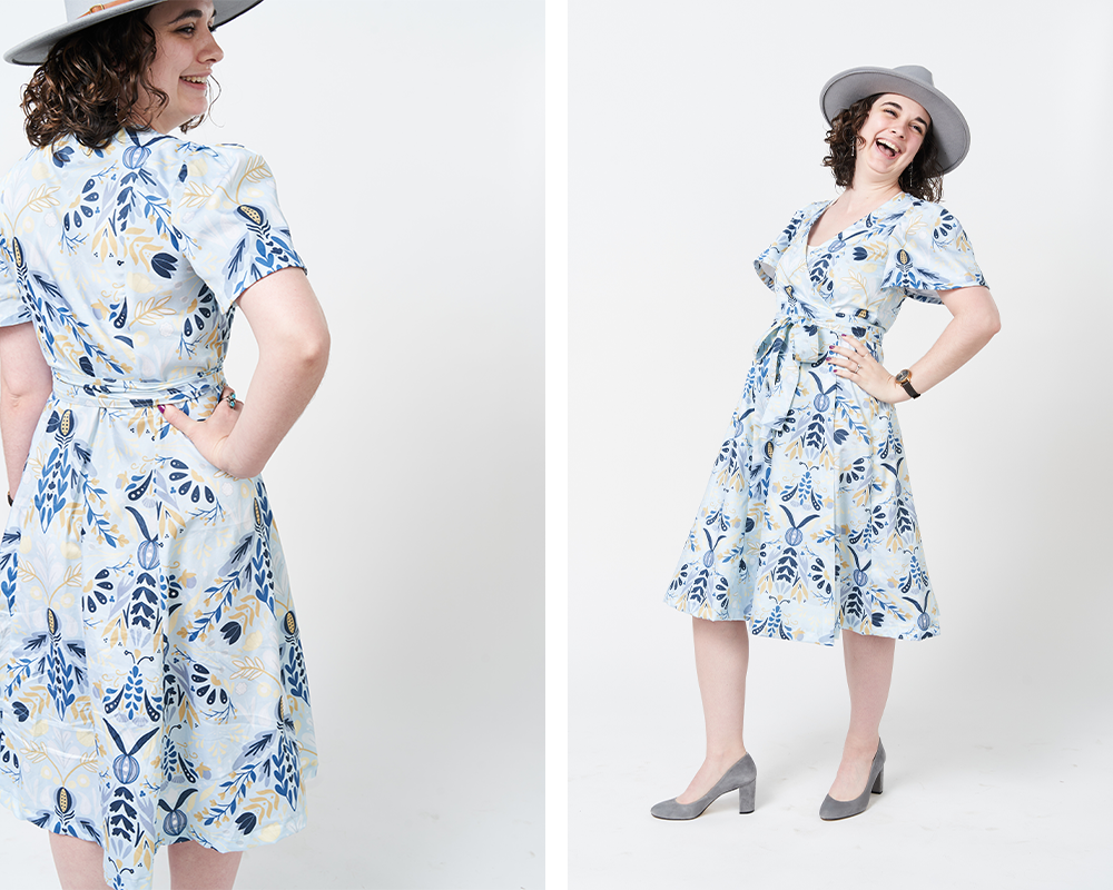 Two photos have been placed side by side in a rectangle. On the left, a look at the back of Sydney’s wrap dress. Her right hand is on her right hip. The design is a very pale arctic blue and features moths and flowers. On the right, a look at the front of the dress. Sydney’s left hand is on her left hip and her head is thrown back in laughter. In both images, she is standing in front of a white background