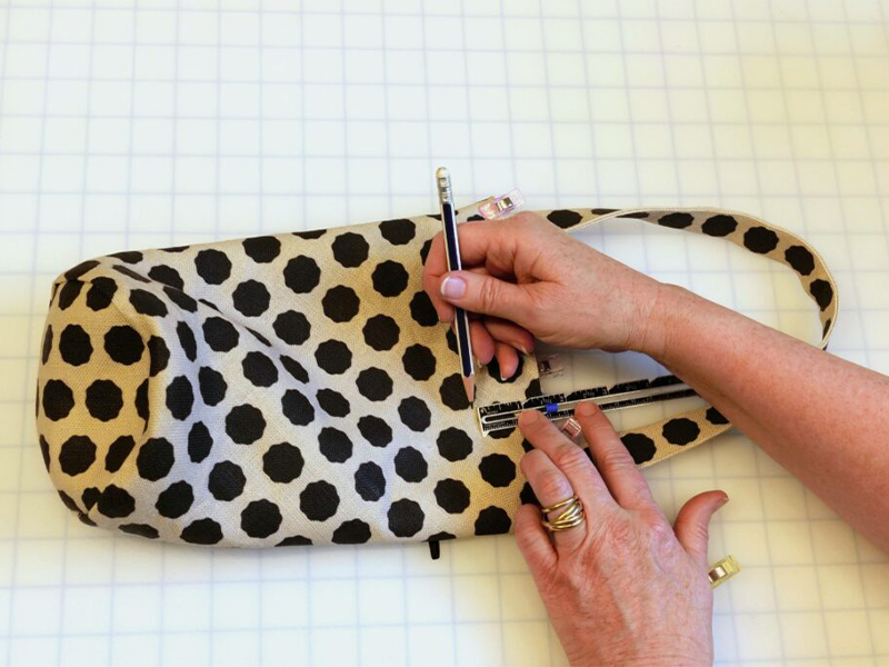 Marking the top stitch line on the outer bag.
