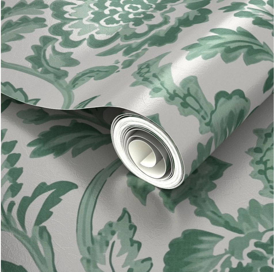 A close-up look at a wallpaper roll with green flowers and leaves on a silver background as used in a Spoonflower design render. The render is showing how the design will be printed on Silver Metallic Wallpaper.